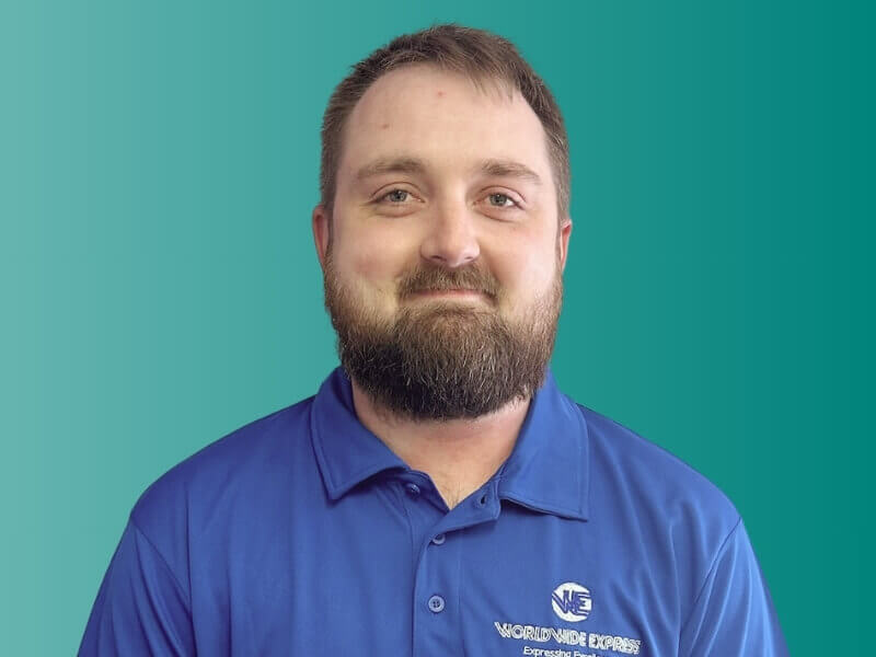 Portrait Photo of Jamie wearing a Worldwide Express branded polo shirt