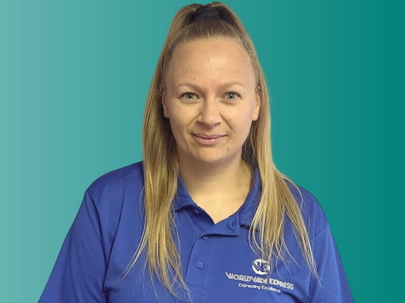 Portrait Photo of Paris wearing a Worldwide Express branded polo shirt